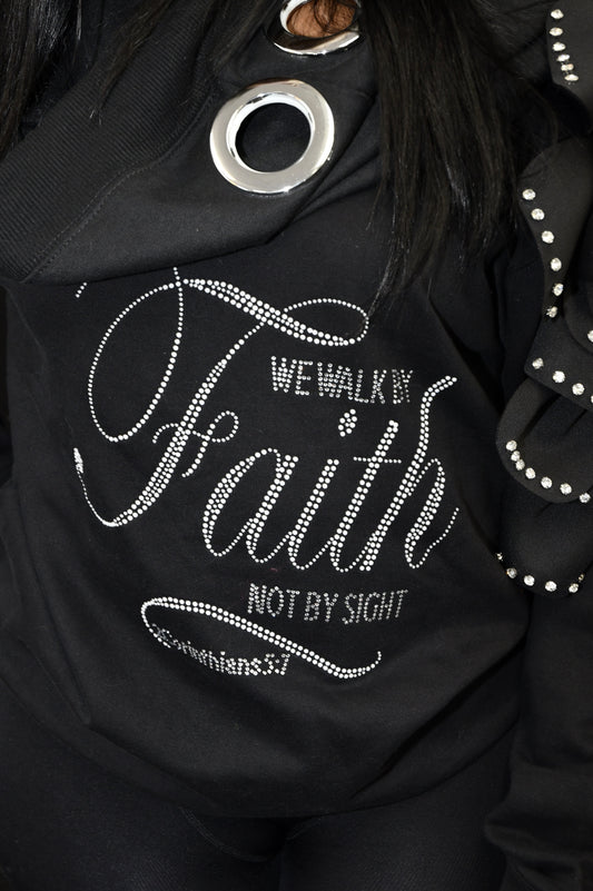 Black jacket with rhinestone-embellished text and designs on a dark background